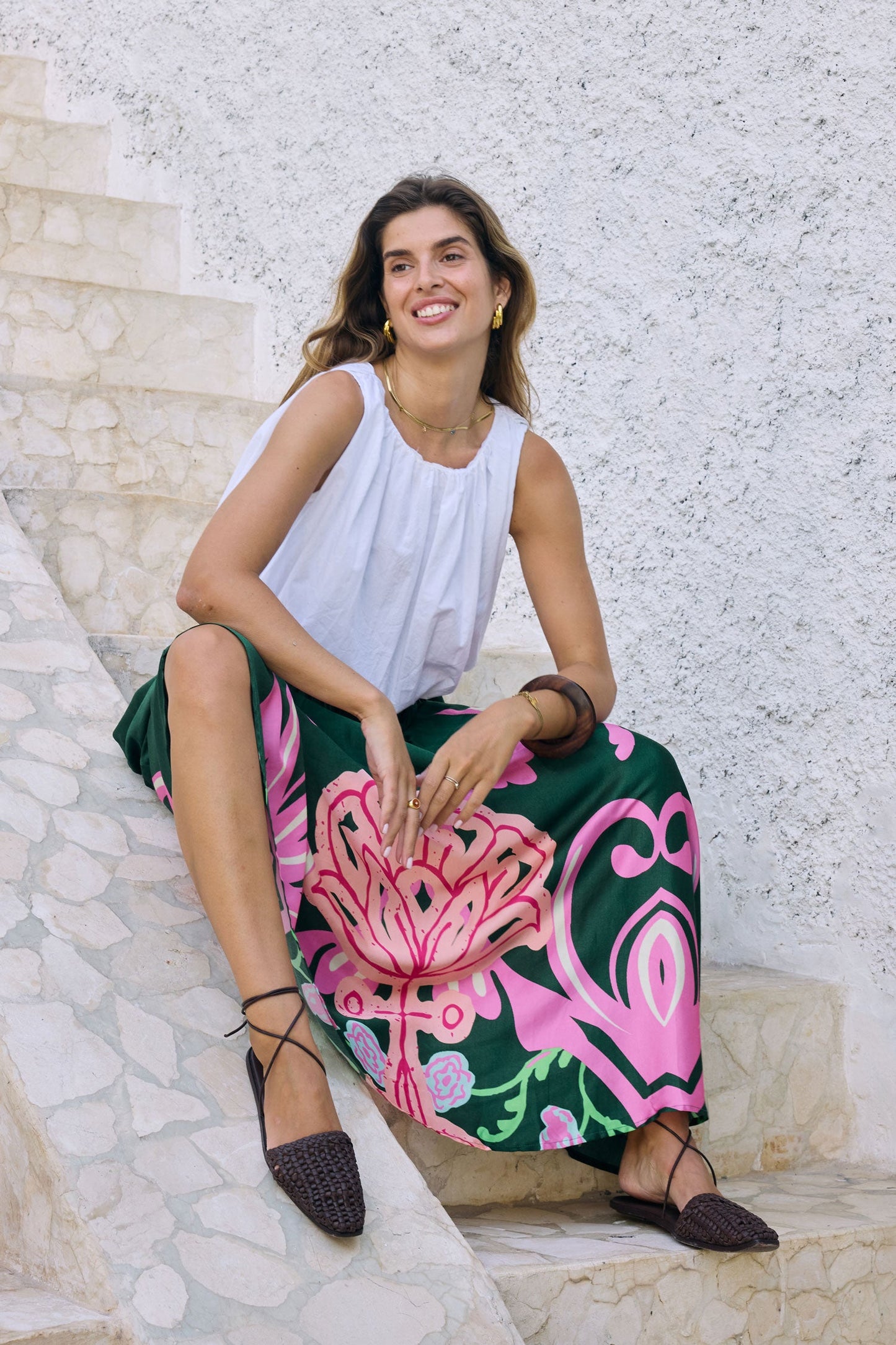 Image of a model wearing Skirts. Product name - Itami Fontes Skirt Olive in Olive colour by brand - Itami Division