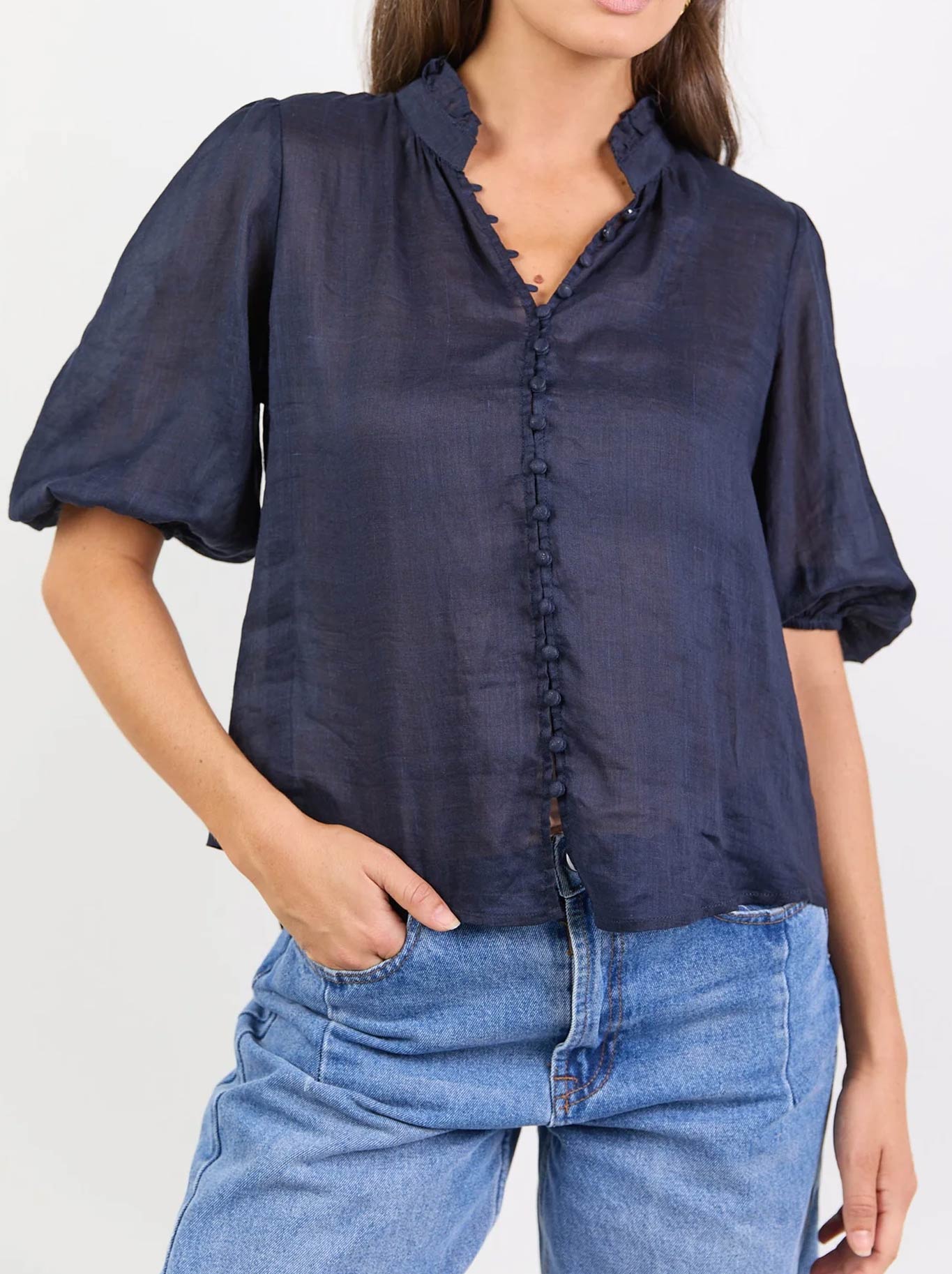 Image of a model wearing Tops. Product name - Ivy & Jack Continuance Ramie High Neck Top in Navy colour by brand - Ivy & Jack