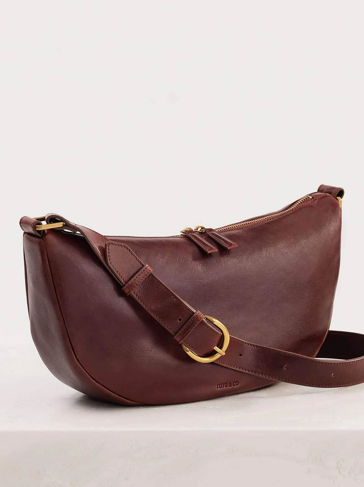Image of Bags. Product name - JUJU & CO CRESCENT SLING BAG in Maple colour by brand - Juju & Co.
