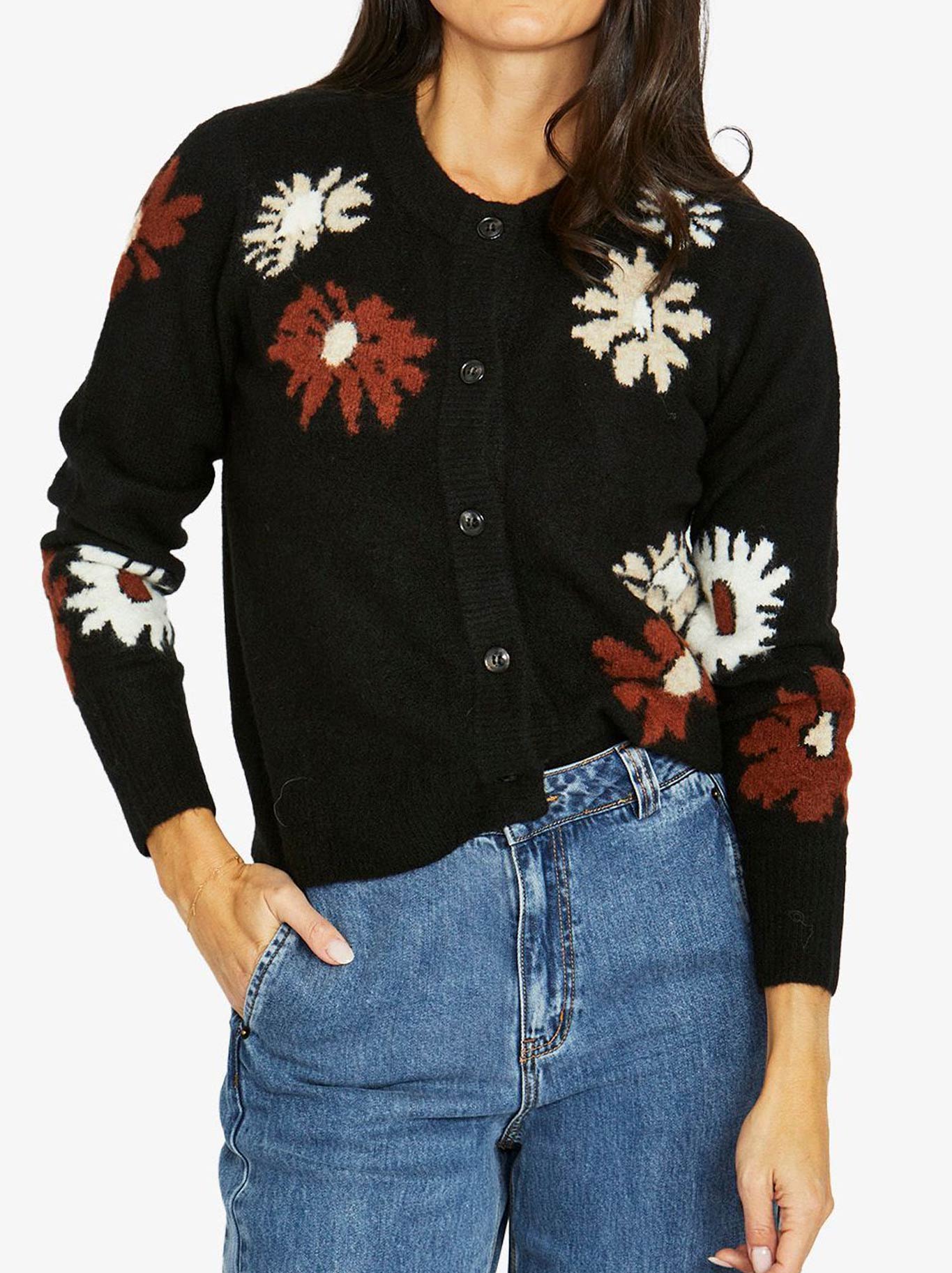 Image of a model wearing Outerwear. Product name - JUMP DAISY CARDIGAN in Black Combo colour by brand - Jump