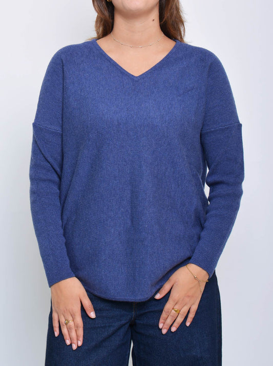 Image of a model wearing Outerwear. Product name - James Melbourne Curved Hem Vee Neck in Denim colour by brand - James Melbourne