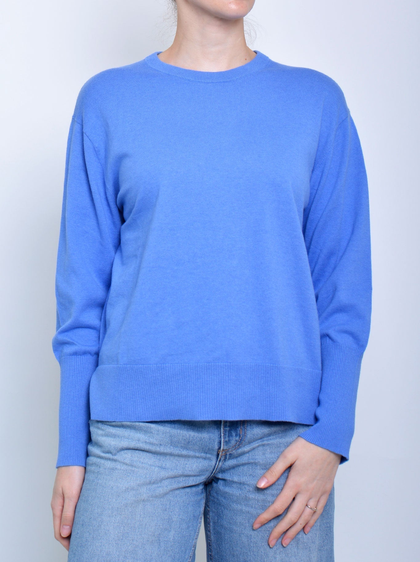 Image of a model wearing Tops. Productname: JAMES MELBOURNE CREW NECK KNIT in Light Blue colour by brand - James Melbourne