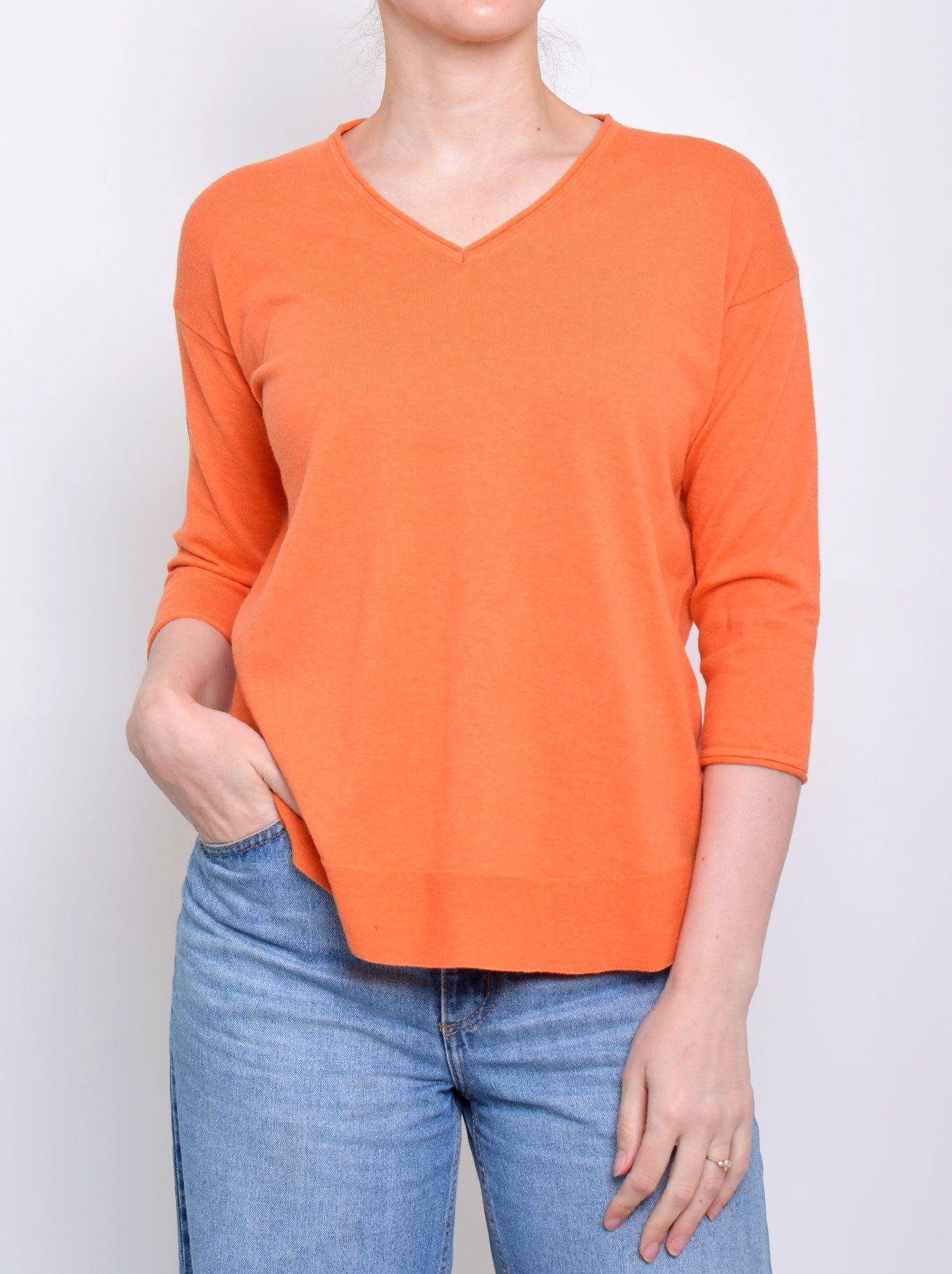 Image of a model wearing Tops. Productname: JAMES MELBOURNE VEE NECK 3/4 SLEEVE KNIT in Orange colour by brand - James Melbourne