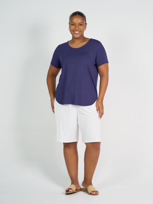 Image of a model wearing Tops. Product name - Janis Short Sleeve Bamboo T-Shirt Blue in Blue colour by brand - Lou Lou
