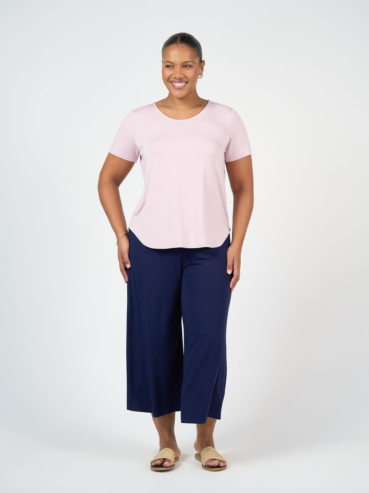 Image of a model wearing Tops. Product name - Janis Short Sleeve Bamboo T-Shirt Lilac in Lilac colour by brand - Lou Lou