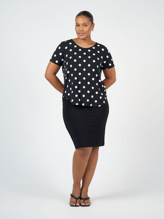 Image of a model wearing Tops. Product name - Janis Short Sleeve Bamboo T-Shirt Polka Dot in Polka Dot colour by brand - Lou Lou