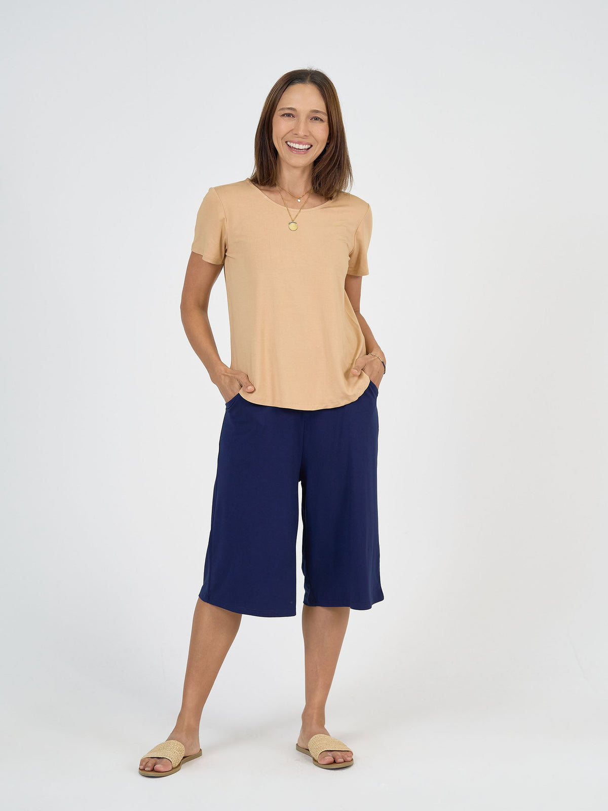 Image of a model wearing Shorts. Product name - Bakar 3/4 Length Bamboo Culottes Navy in Navy colour by brand - Lou Lou