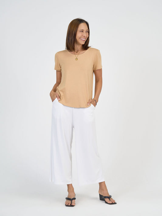 Image of a model wearing Tops. Product name - Janis Short Sleeve Bamboo T-Shirt Tan in Tan colour by brand - Lou Lou