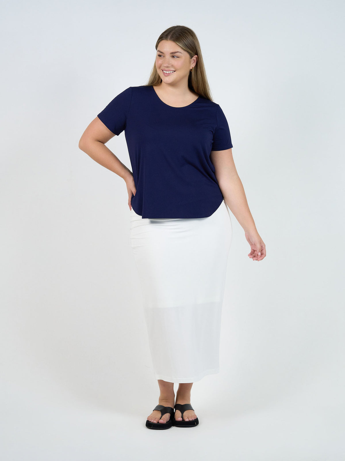 Image of a model wearing Tops. Product name - Janis Short Sleeve Bamboo T-Shirt Navy in Navy colour by brand - Lou Lou