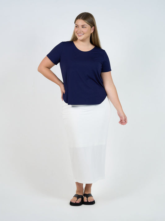 Image of a model wearing Tops. Product name - Janis Short Sleeve Bamboo T-Shirt Navy in Navy colour by brand - Lou Lou