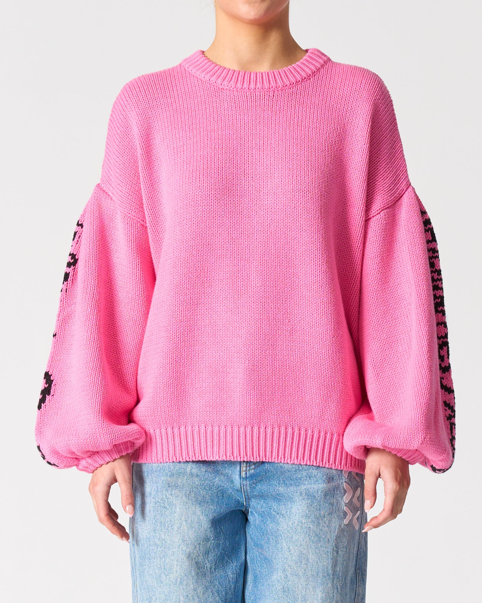 Image of a model wearing Outerwear. Productname: Jardin Des Fleurs Jumper in Pink colour by brand - Walnut Melbourne