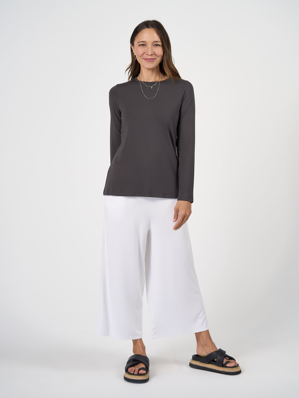 Image of a model wearing Tops. Product name - Jones Long Sleeve Fitted Bamboo Top Steel in Steel colour by brand - Lou Lou