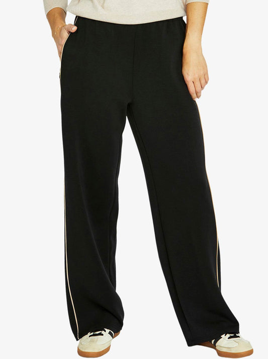 Image of a model wearing Pants. Productname: JUMP SIDE STRIPE LOUNGE PANT in Black colour by brand - Jump