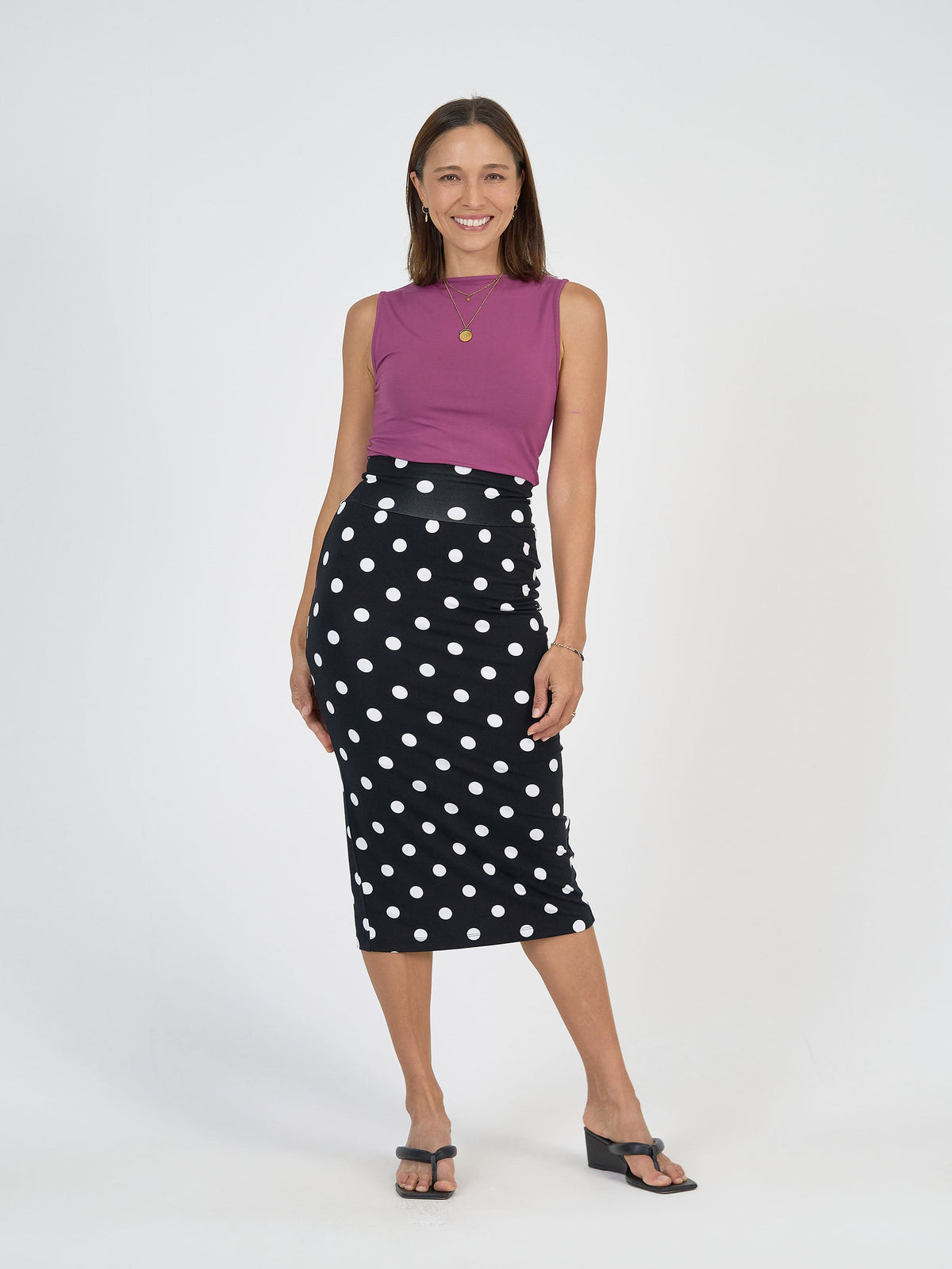 Image of a model wearing Tops. Product name - Kate Bamboo Tank Plum in Plum colour by brand - Lou Lou
