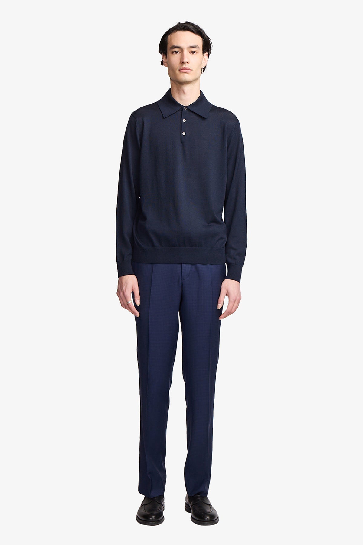Image of a model wearing Tops. Productname: Anthony Squires Kelvin navy L/S knit polo in Blue colour by brand - Anthony Squires