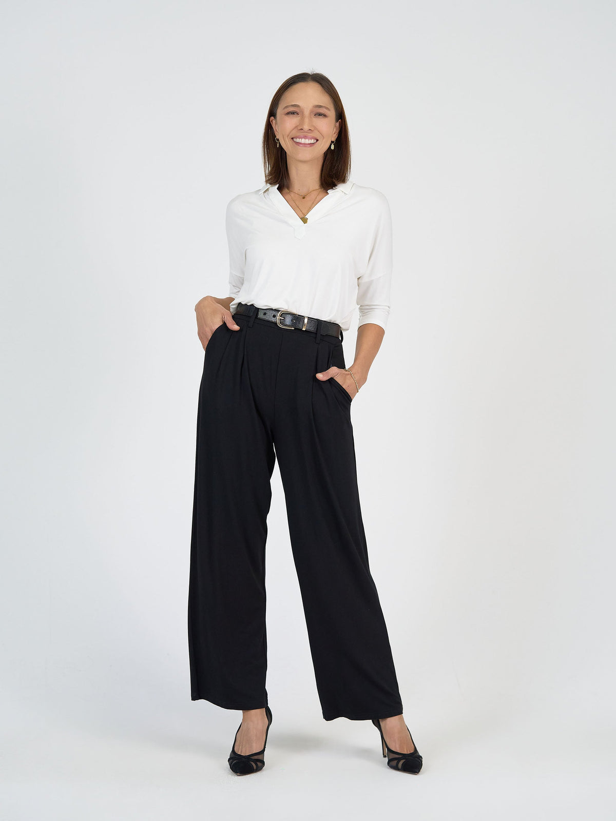 Image of a model wearing Tops. Product name - Khan Bamboo 3/4 Sleeve Collared Polo Top Cream in Cream colour by brand - Lou Lou