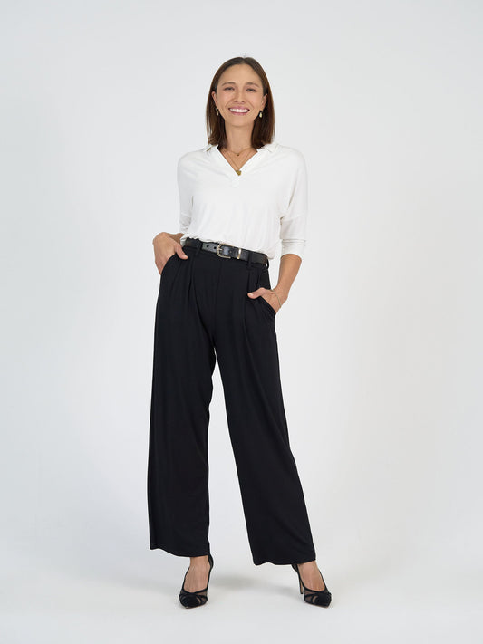 Image of a model wearing Tops. Product name - Khan Bamboo 3/4 Sleeve Collared Polo Top Cream in Cream colour by brand - Lou Lou