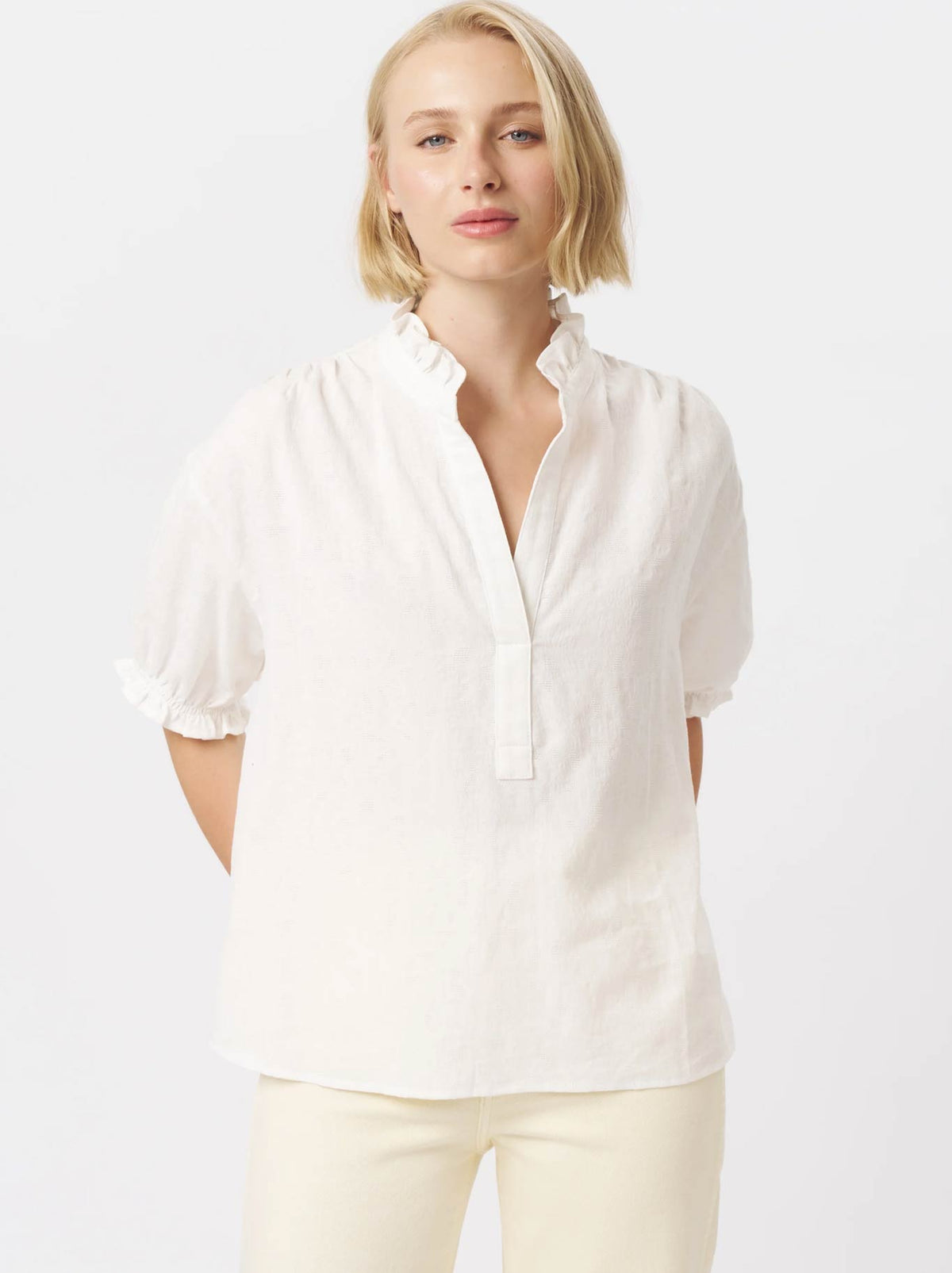 Image of a model wearing Tops. Product name - KIREINA AMBER SHIRT in White Flower colour by brand - Kireina