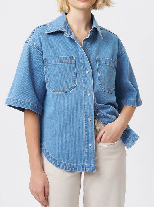 Image of a model wearing Tops. Product name - KIREINA BETH CORDUROY SHIRT in Mid Blue colour by brand - Kireina