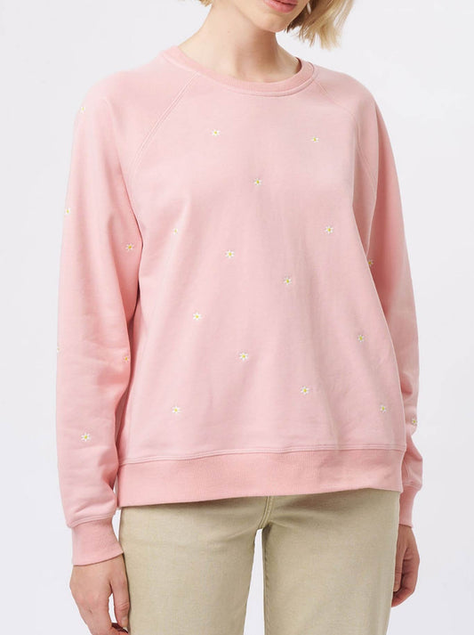 Image of a model wearing Tops. Product name - Kireina Patti Sweatshirt in Musk Pink Daisy colour by brand - Kireina