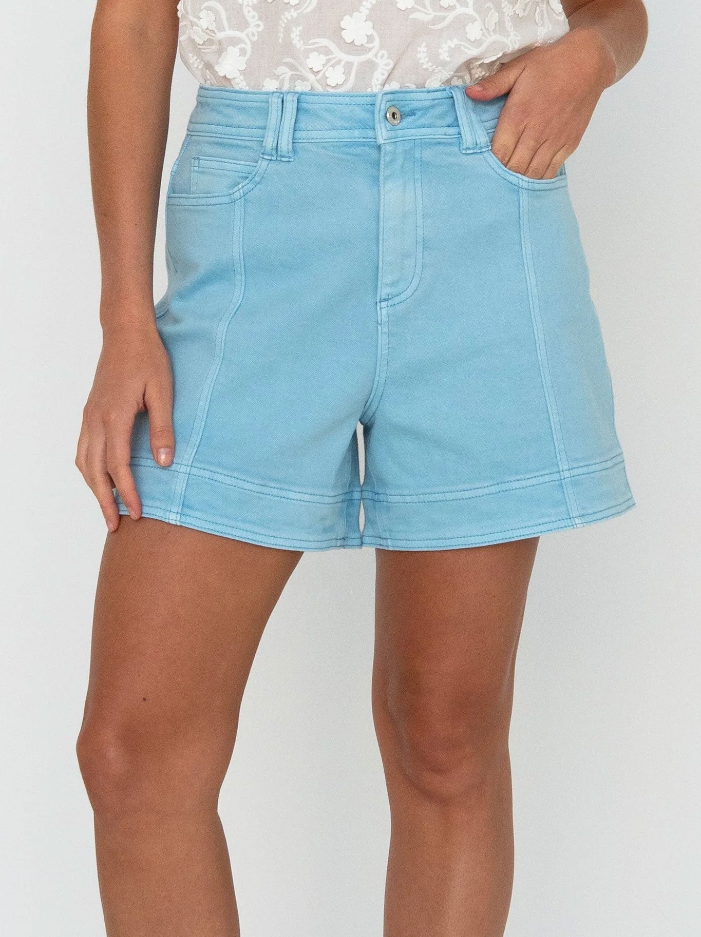 Image of a model wearing Shorts. Product name - Kireina Sydney Short in Washed Blue colour by brand - Kireina