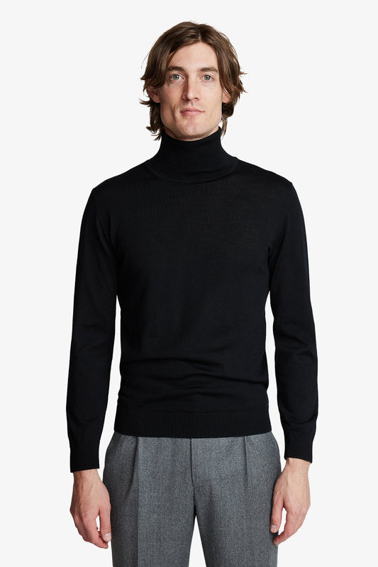 Image of a model wearing Outerwear. Product name - Kurt Black Roll-neck in Black colour by brand - Anthony Squires