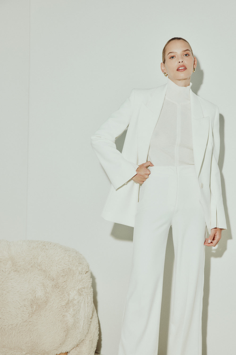 Image of a model wearing Tops. Productname: Lines Of Distinction Knit Top in Ivory colour by brand - Manning Cartell