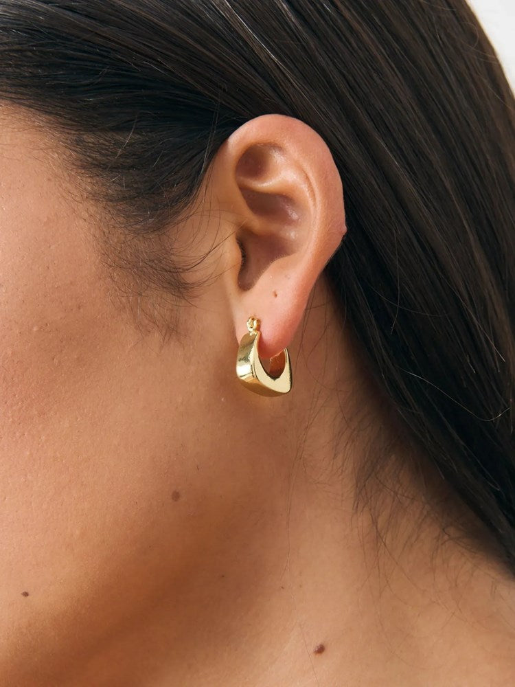 Image of Earrings. Product name - Nora Huggie 18K Gold Plated Earrings Gold in Gold colour by brand - Betty Basics
