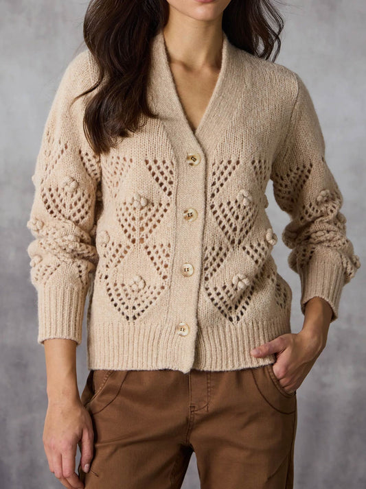 Image of a model wearing Outerwear. Productname: Lania The Label Trellis Cardi in Honey colour by brand - Lania The Label