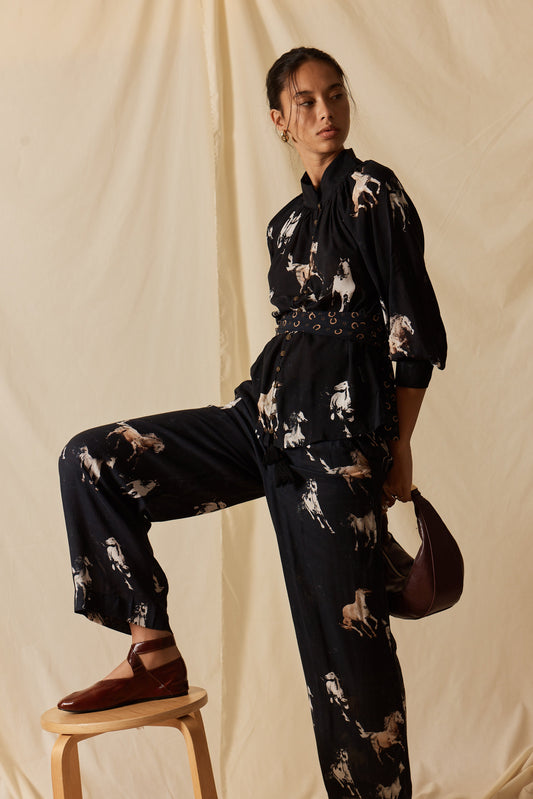 Image of a model wearing Pants. Product name - LulaSoul Mustang Pant Licorice in Tan colour by brand - LulaSoul