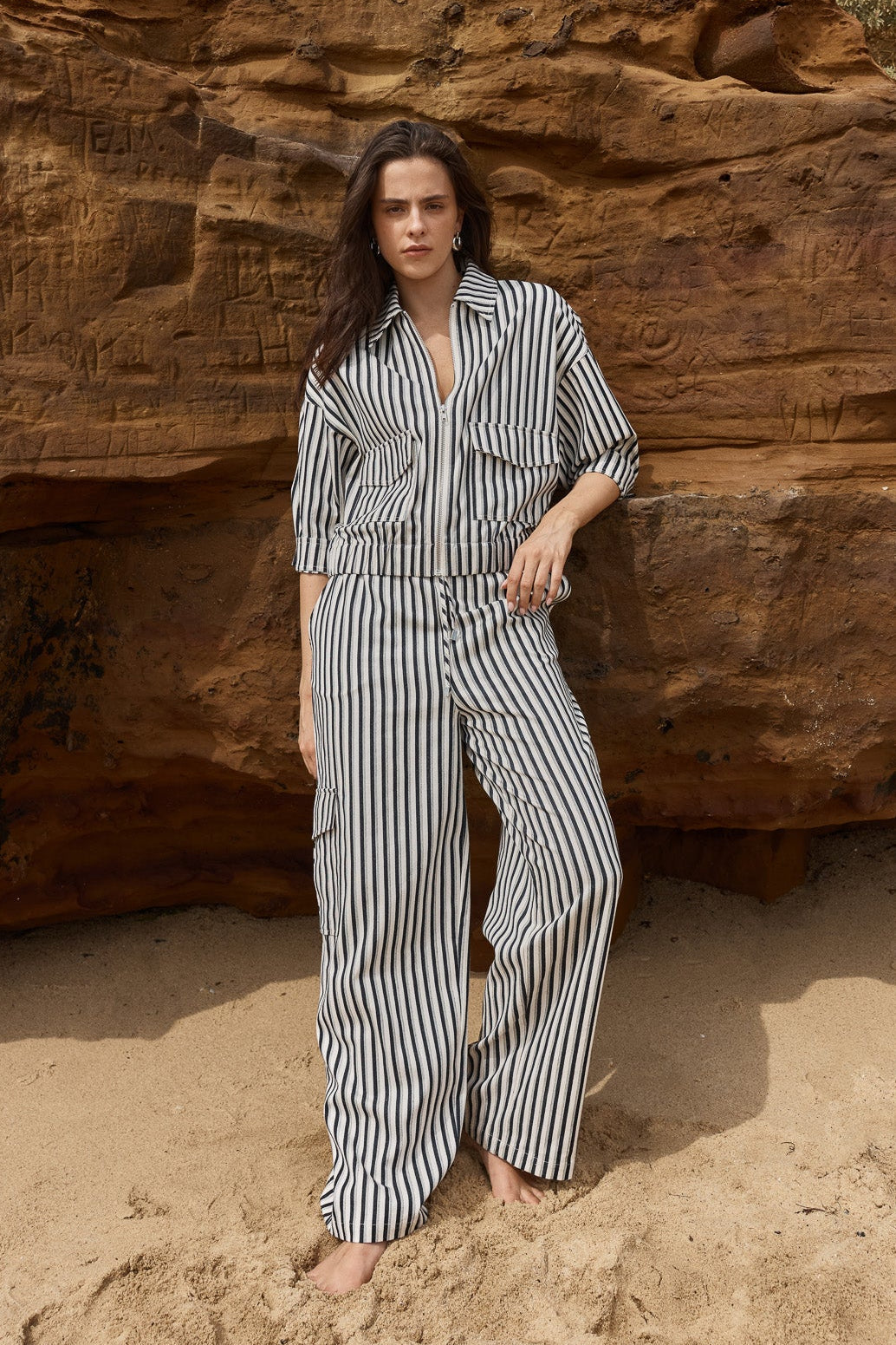 Image of a model wearing Pants. Product name - May Tie Waist Cargo Black Cream in Black Cream colour by brand - Sass Clothing