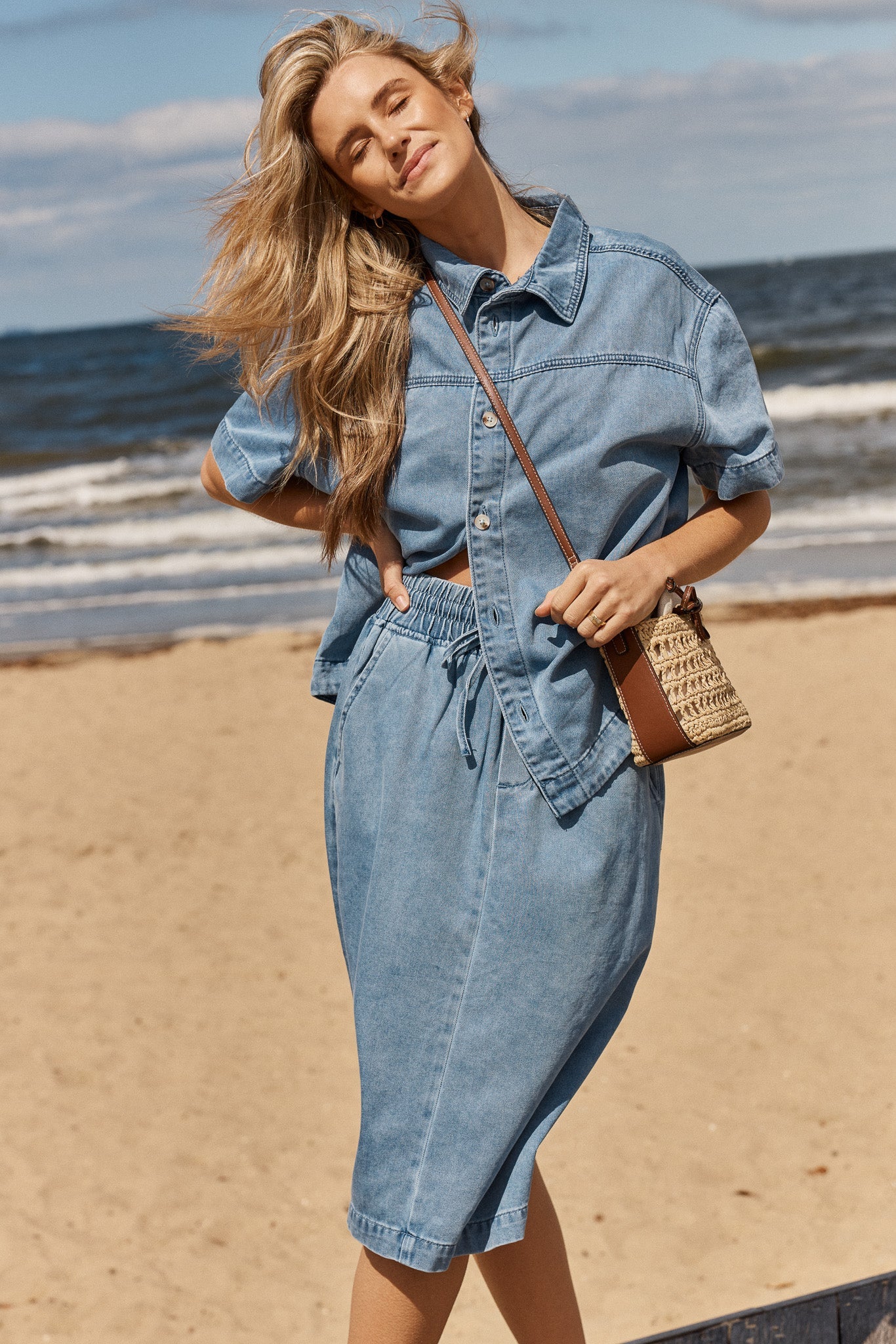 Image of a model wearing Skirts. Product name - Quinn Cotton Skirt Blue Medium in Blue Medium colour by brand - Betty Basics