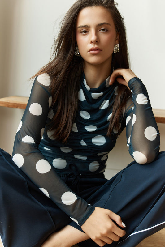Image of a model wearing Tops. Product name - Pammie Seamed Mesh Top in Spot colour by brand - Sass Clothing