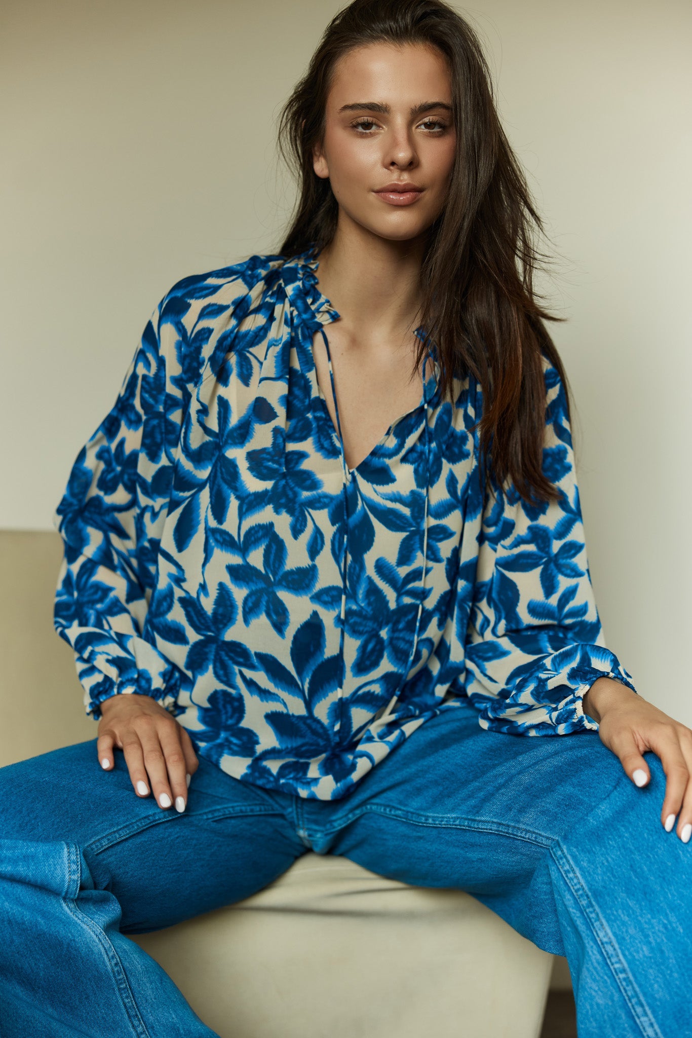 Image of a model wearing Tops. Product name - Willow Tie Front Blouse in Blue Iris colour by brand - Sass Clothing