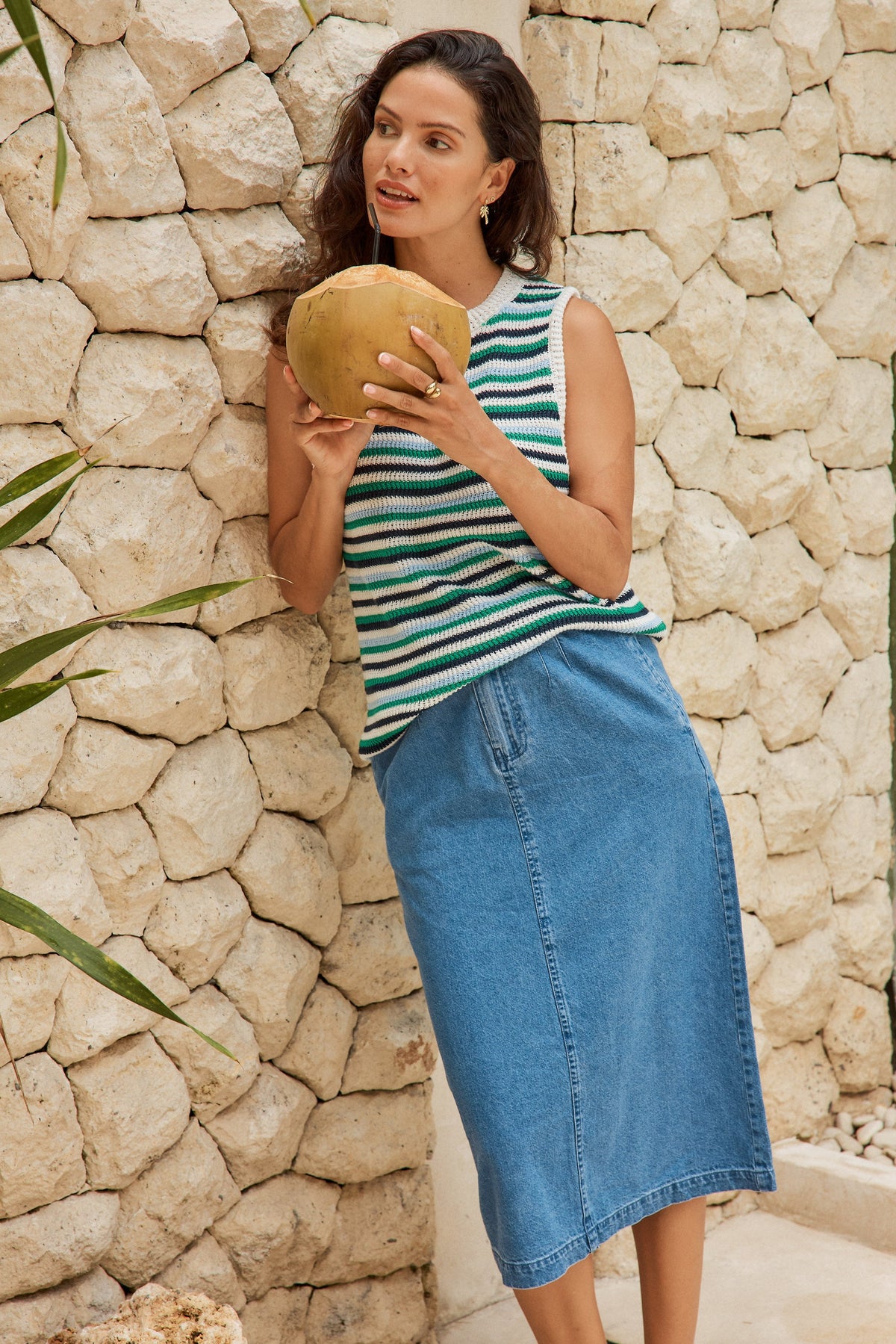 Image of a model wearing Skirts. Product name - Solange Midi Denim Skirt Medium Wash in Medium Wash colour by brand - Betty Basics