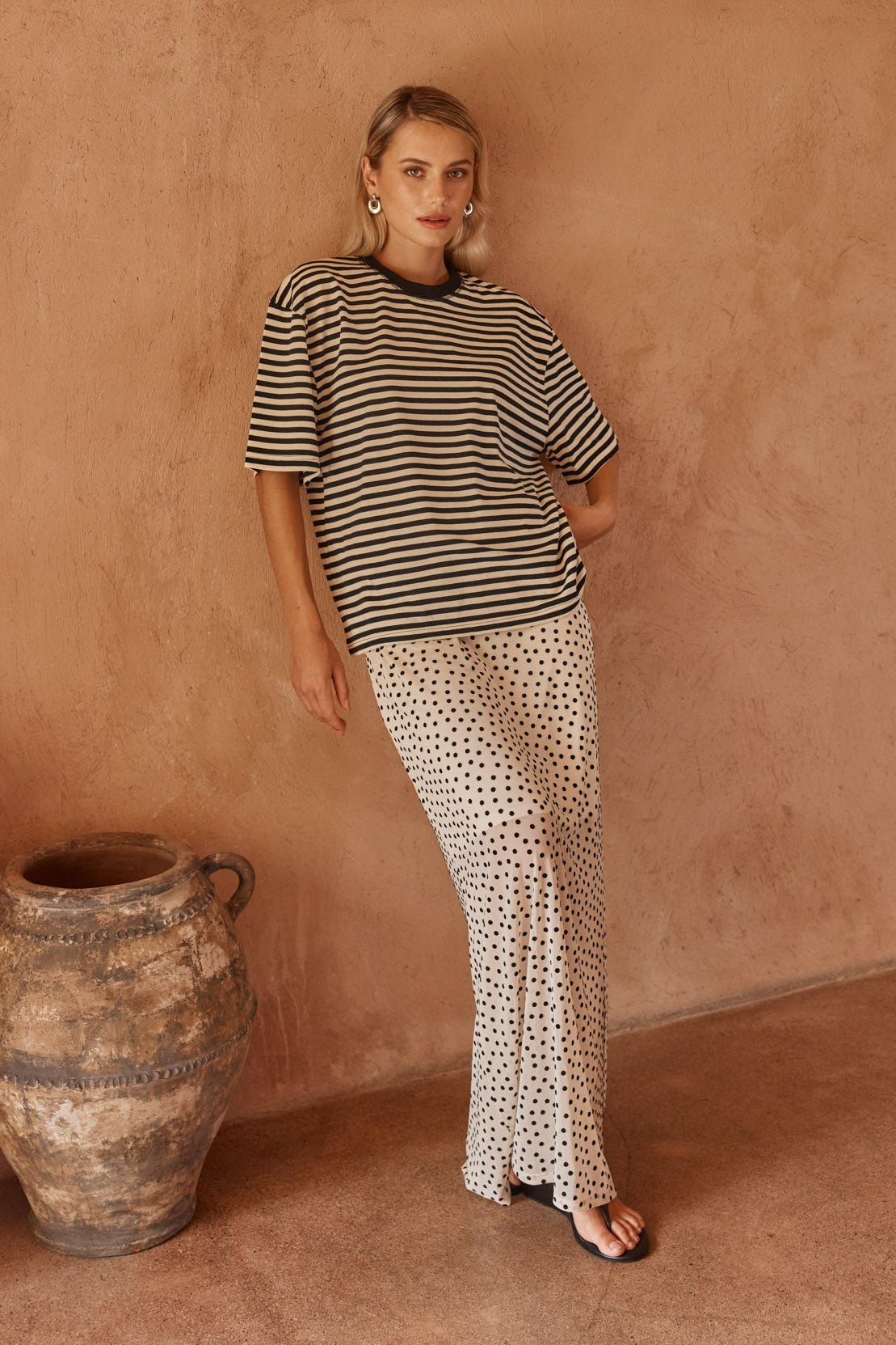 Image of a model wearing Skirts. Product name - Rachel Spot Mesh Maxi Skirt White/Black in White/ Black colour by brand - Sass Clothing