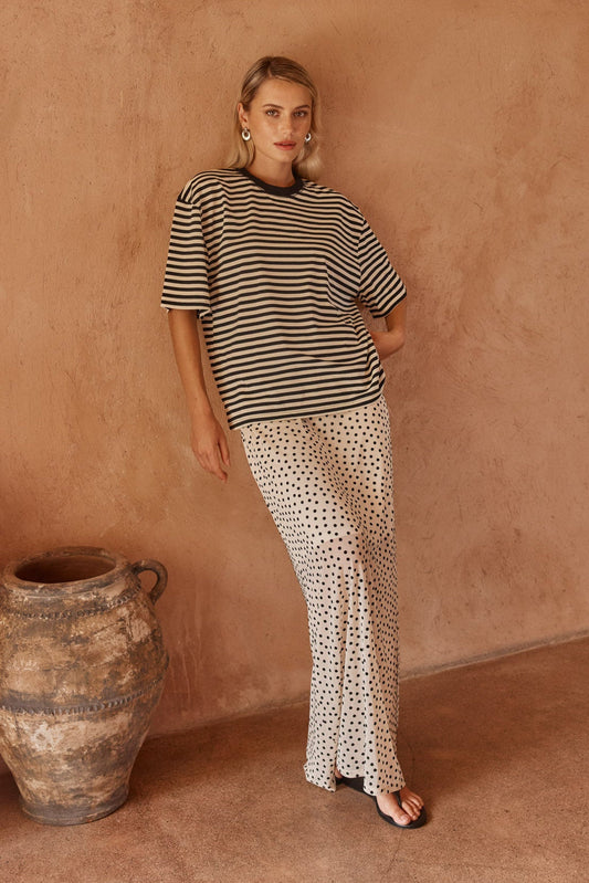 Image of a model wearing Skirts. Product name - Rachel Spot Mesh Maxi Skirt White/Black in White/ Black colour by brand - Sass Clothing