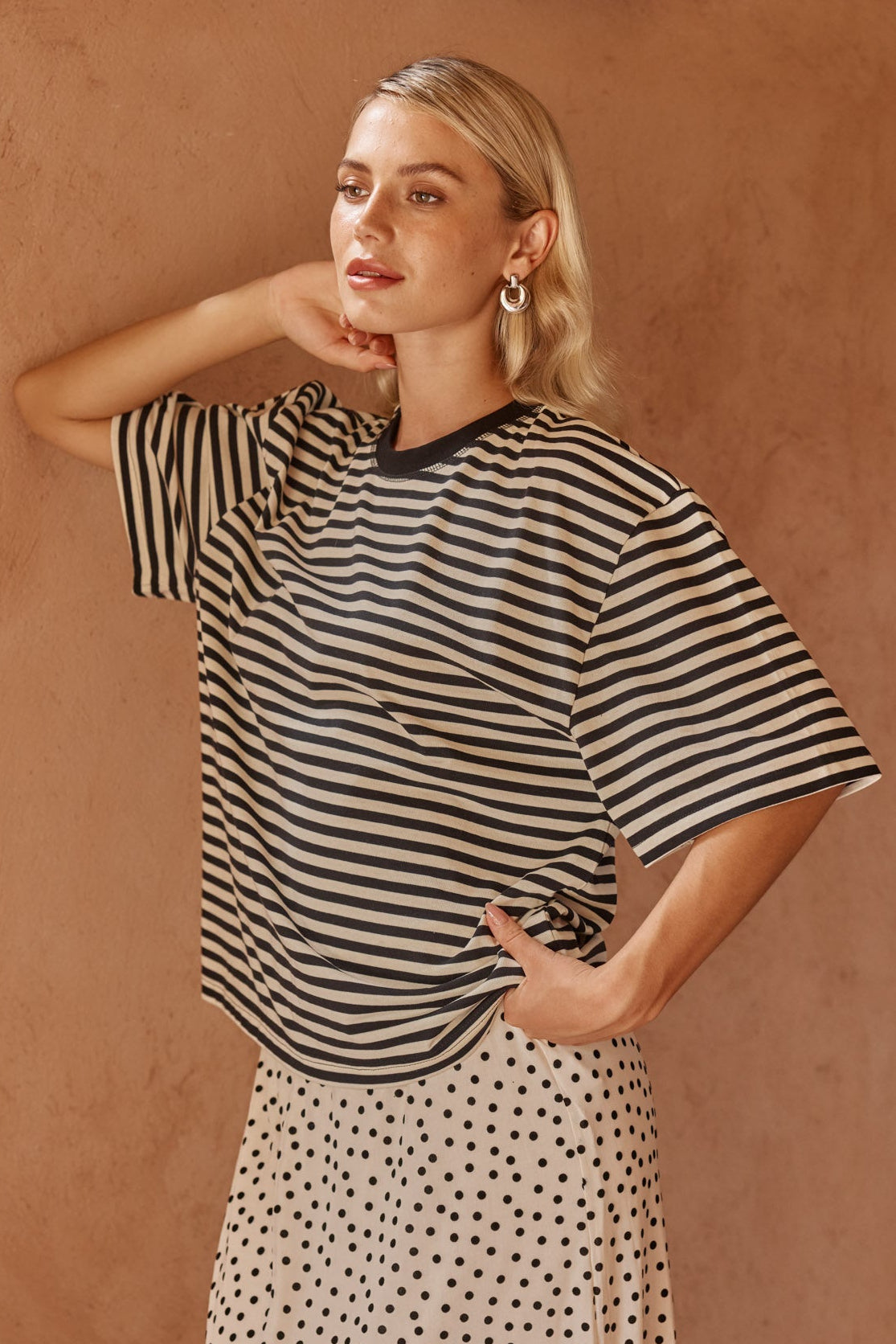 Image of a model wearing Tops. Product name - Jazel Slouch Stripe Tee Black/White in Black/ White colour by brand - Sass Clothing