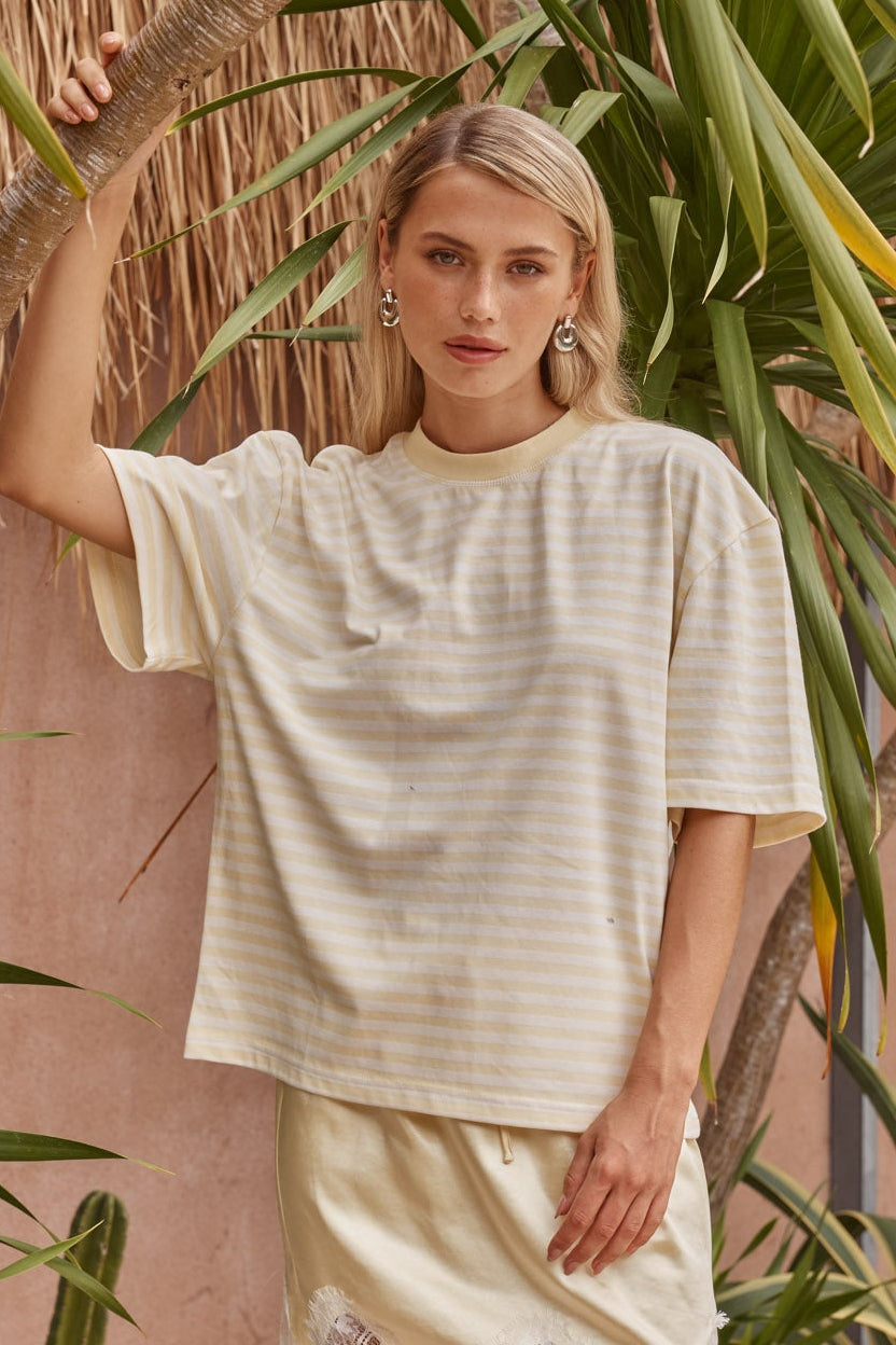 Image of a model wearing Tops. Product name - Jazel Slouch Stripe Tee Lemon/White in Lemon/ White colour by brand - Sass Clothing