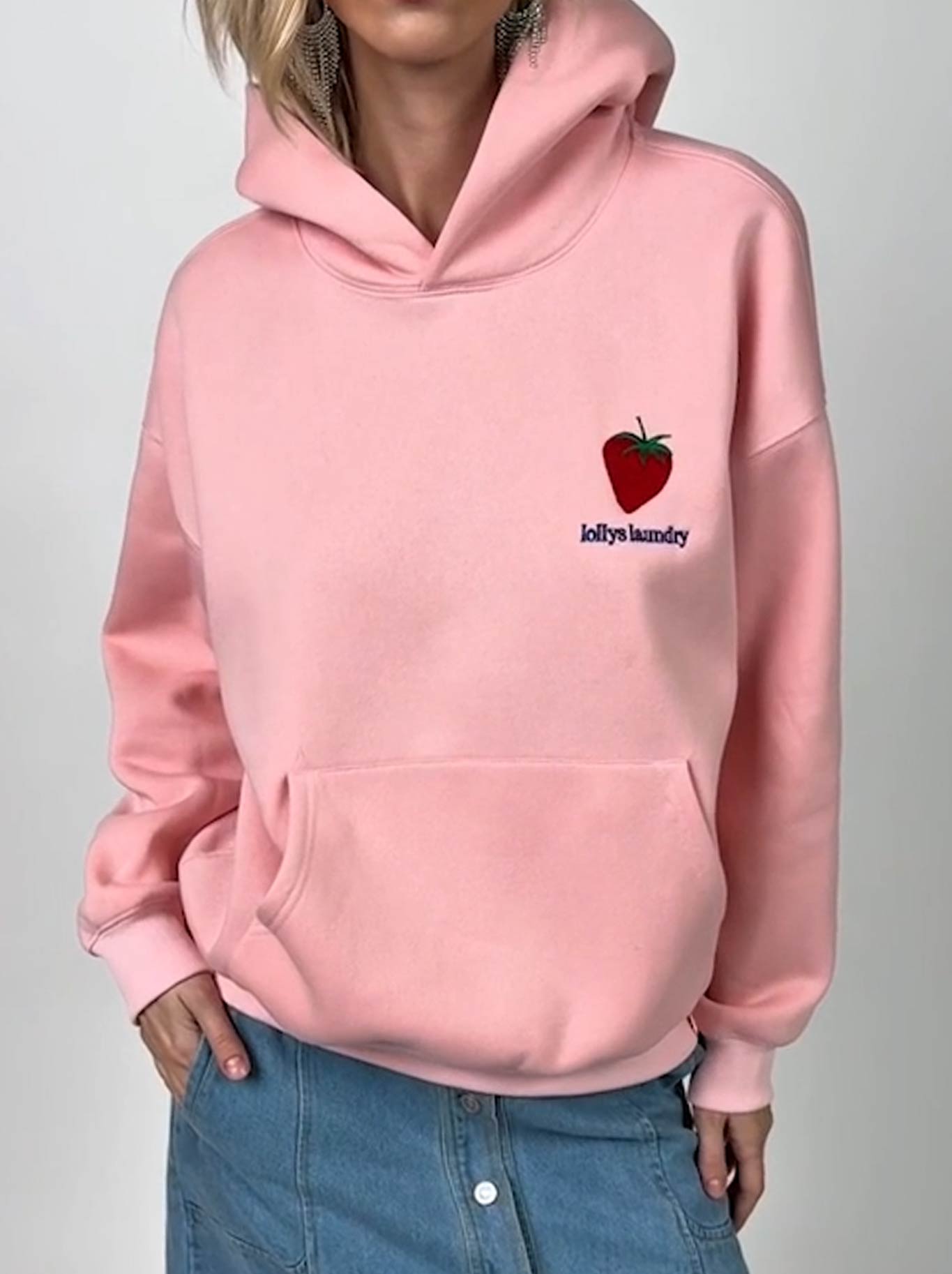 Image of a model wearing Tops. Product name - Lollys Laundry Lennox Sweatshirt in Light Pink colour by brand - Lollys Laundry