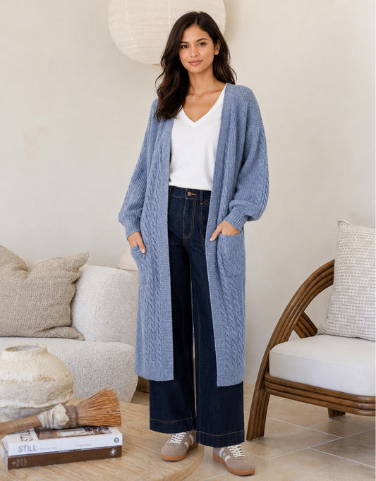 Image of a model wearing Outerwear. Product name - Longline Cable Cardi Blue in Blue colour by brand - 132 Fashion