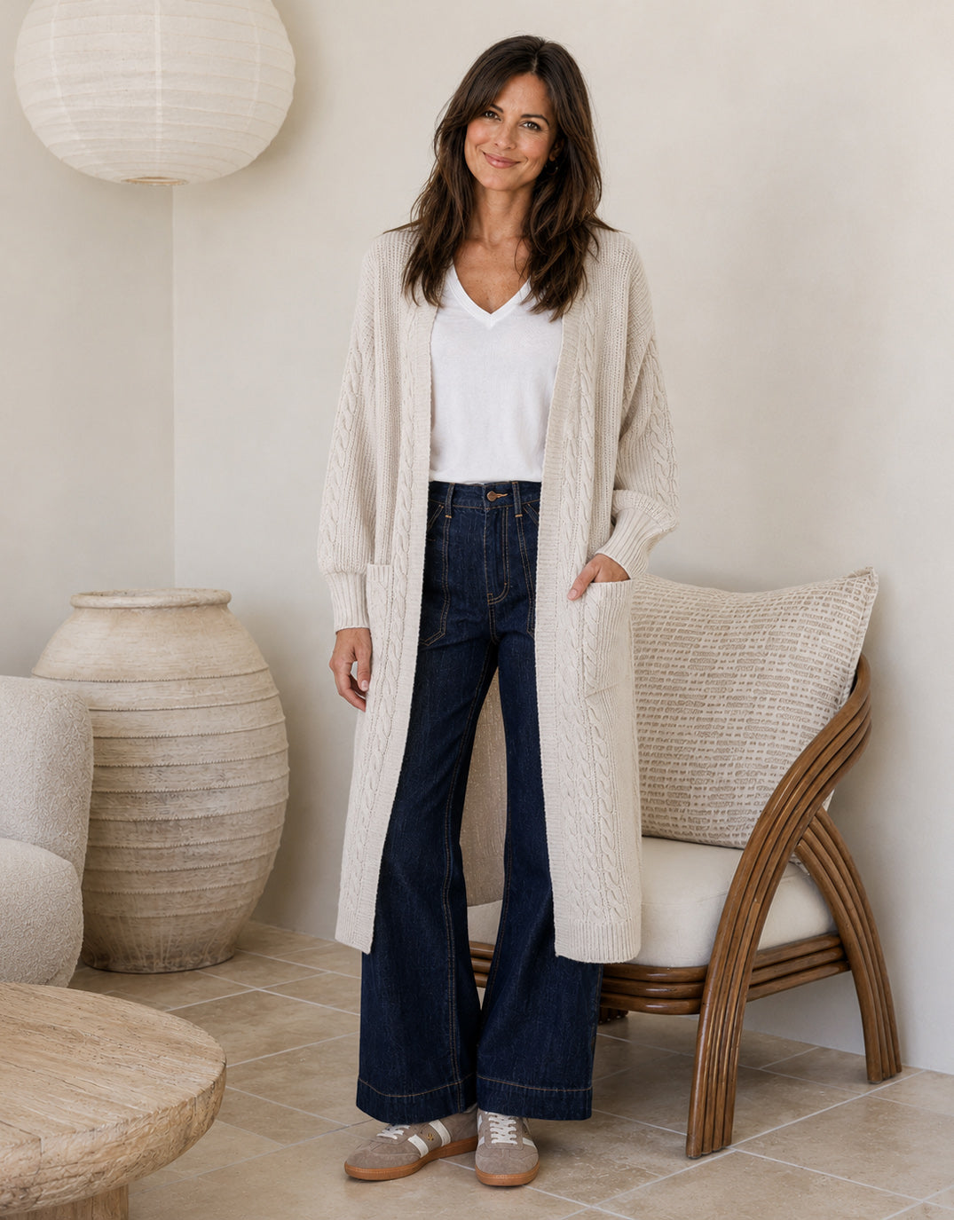 Image of a model wearing Outerwear. Product name - Longline Cable Cardi Latte in Beige colour by brand - 132 Fashion