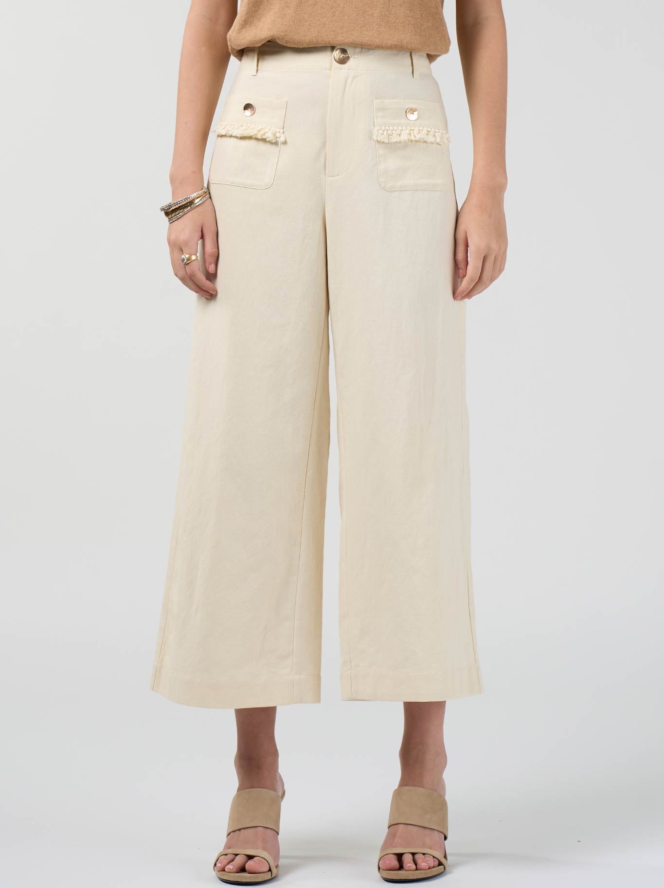 Image of a model wearing Pants. Product name - Loobie'S Story Navi Pant in Buttermilk colour by brand - Loobies Story
