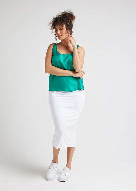 Image of a model wearing Tops. Product name - Poppy Silk Sleeveless Camisole Emerald Green in Emerald Green colour by brand - Lou Lou