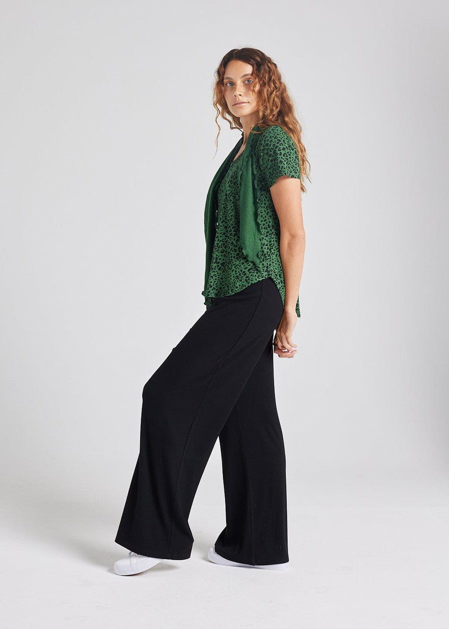 Image of a model wearing Tops. Product name - Veronica Bamboo V-Neck T-Shirt Green Leopard in Green Leopard colour by brand - Lou Lou