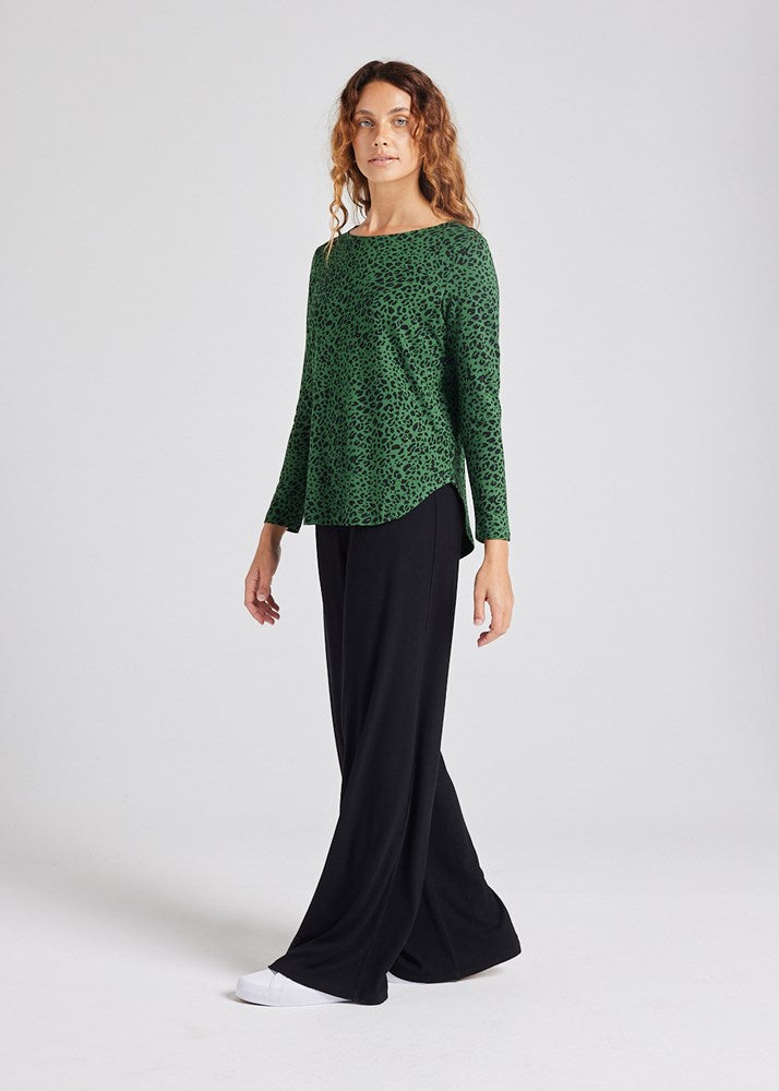 Image of a model wearing Tops. Product name - Adele Long Sleeve Bamboo Top Green Leopard in Green Leopard colour by brand - Lou Lou