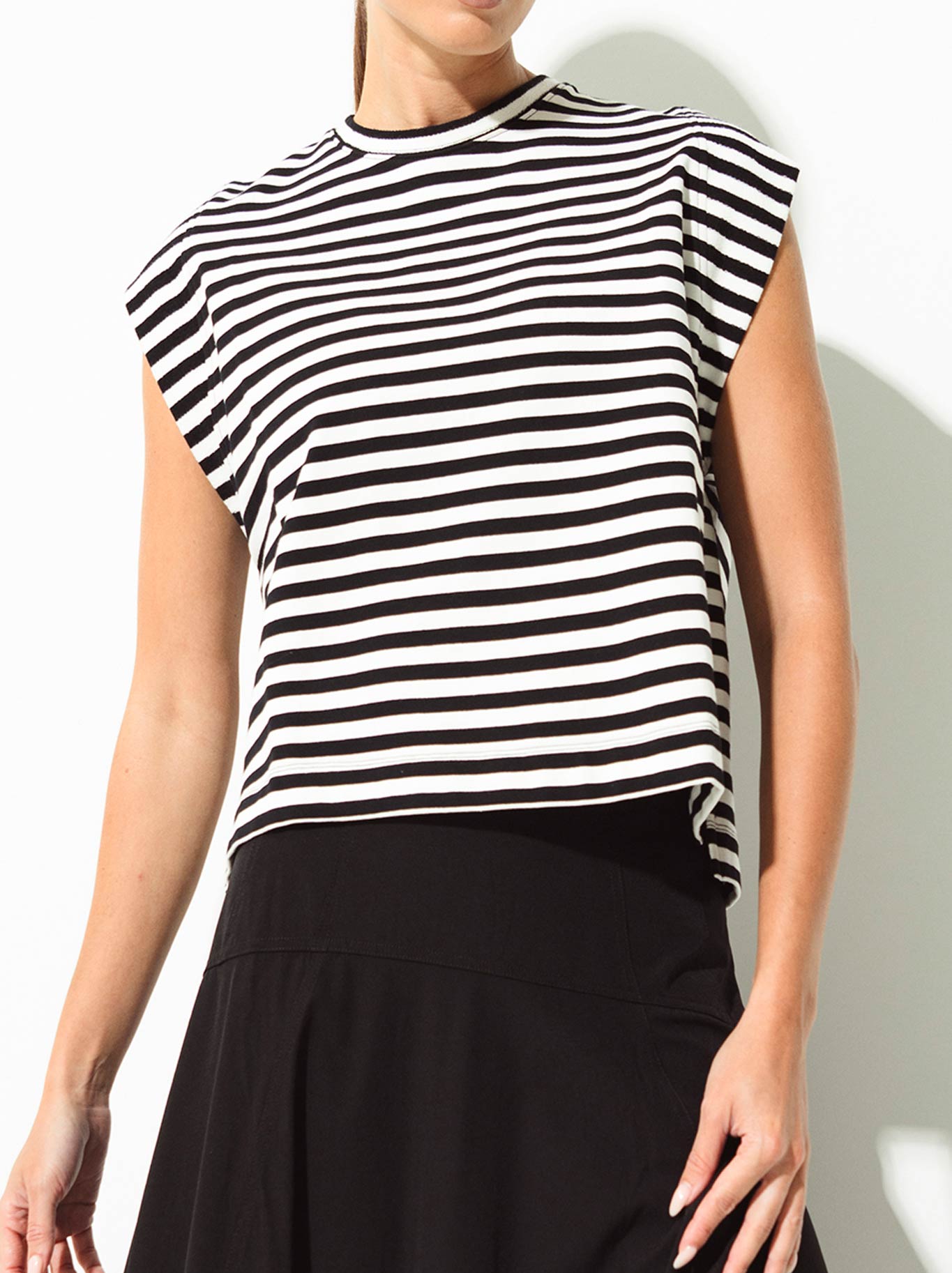 Image of a model wearing Tops. Product name - Lounge The Label Comporta Top in Black White colour by brand - Lounge