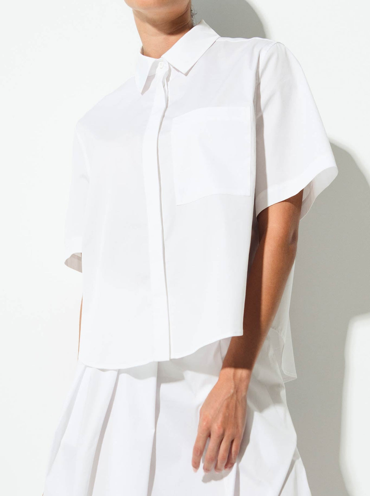 Image of a model wearing Tops. Product name - Lounge The Label Vahine Shirt in White colour by brand - Lounge