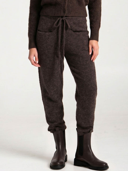 Image of a model wearing Pants. Product name - LOUNGE THE LABEL PALO PANT in Espresso colour by brand - Lounge