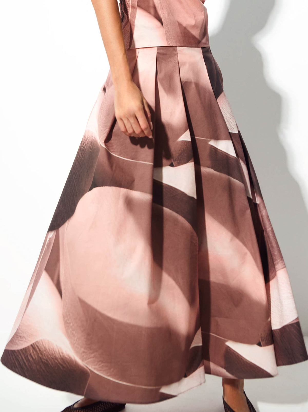 Image of a model wearing Skirts. Product name - Lounge The Label Sacher Skirt in Petal colour by brand - Lounge